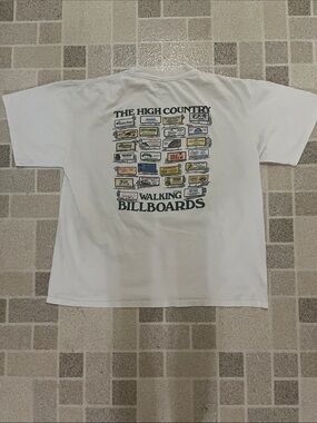 Vintage Jensen White Short-Sleeve Crewneck T-Shirt with Chest Logo. Blowing rock